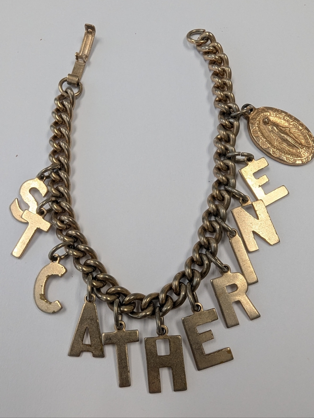 VTG 60'S GOLD TONE ST CATHERINE CHARM BRACELET
